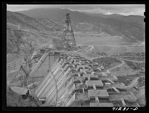 Untitled photo, possibly related to: Shasta Dam under construction. Cable cars carrying materials operate from the high tower. Shasta County, California