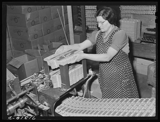 Untitled photo, possibly related to: Petaluma, Sonoma County, California. Cardboard cartons into which eggs will be packed