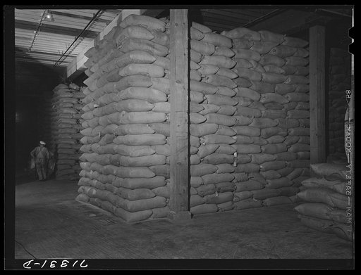 Untitled photo, possibly related to: Petaluma, Sonoma County, California. Feed in warehouse. All feed is bought through cooperatives in this county which has a mass production of eggs