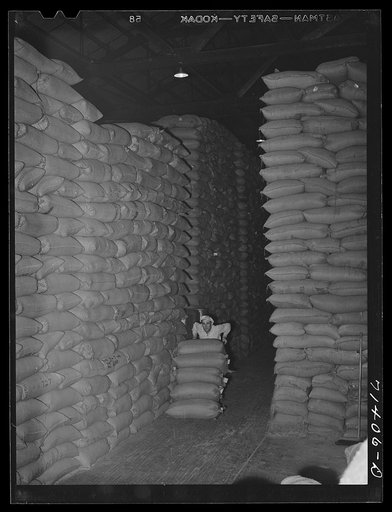 Untitled photo, possibly related to: Petaluma, Sonoma County, California. Feed in warehouse. All feed is bought through cooperatives in this county which has a mass production of eggs