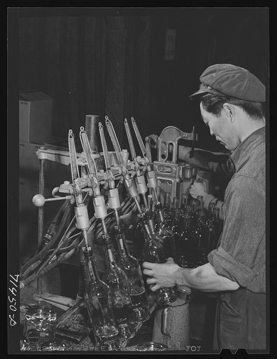 Sonoma County, California. Filling bottles with wine at the winery
