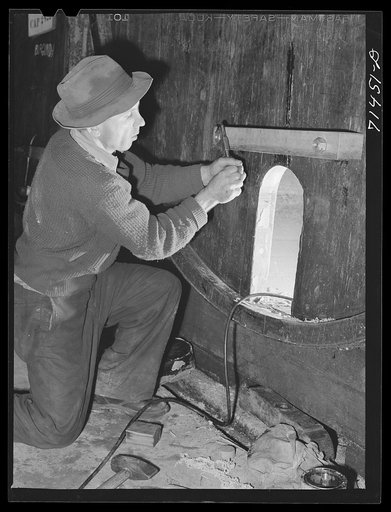 Sonoma County, California. Cooper fitting head of cask at the winery