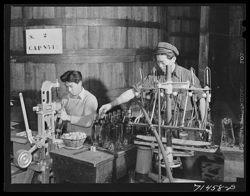 Sonoma County, California. Bottling wine and corking bottles of wine at the winery