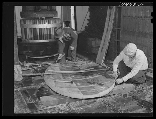 Untitled photo, possibly related to: Sonoma County, California. Coopers making head of cask for wine at the winery
