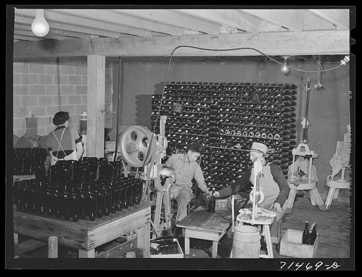 Untitled photo, possibly related to: Sonoma County, California. Bottling and corking champagne in the winery