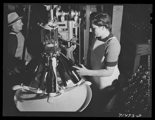 Untitled photo, possibly related to: Sonoma County, California. Filling bottles with champagne at the winery