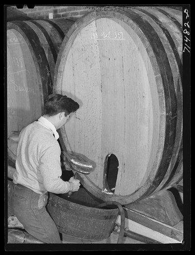 Sonoma County, California. Worker prepares to clean cask used to age wine at the winery