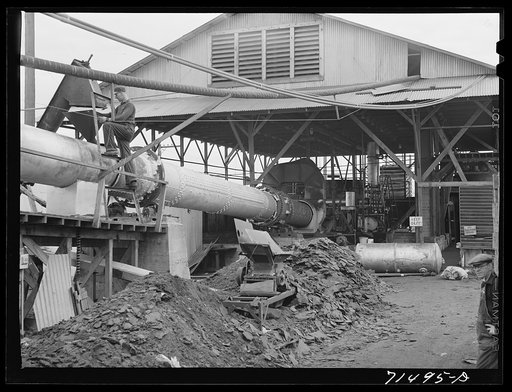 Untitled photo, possibly related to: Byproducts of olive oil. In this plant, "soap" oil is extracted from the cake, leaving the pomace which has some value as a fertilizer. About five percent of the total oil content of olives is "soap" oil. Strathmore, California