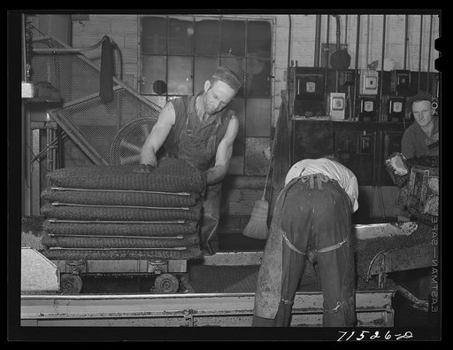 Bags of olive pulp which will be put under hydraulic pressure to extract the oil. Lindsay, California