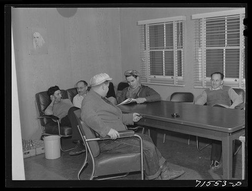 Workmen from Mare Island navy yard in the community room at the FSA (Farm Security Administration) defense housing dormitories. Vallejo, California