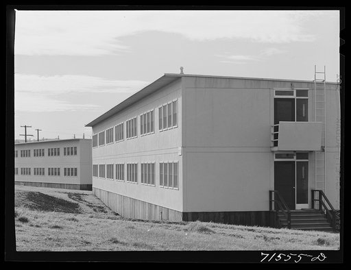 FSA (Farm Security Administration) defense housing dormitories at Vallejo, California. Notice that the lower redwood siding conforms with the contour of the land. There were no excavations made for these buildings and when they have served their purpose they can be removed and leave the landscape in