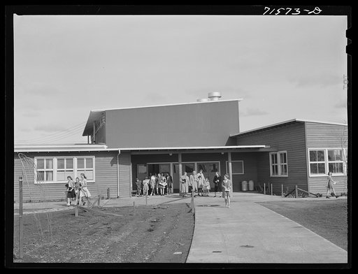 Woodville, California. FSA (Farm Security Administration) farm workers' community. The entrance at the central section of the community building. This high central section is the main auditorium. The rooms open off the auditorium and are used for school and various meetings
