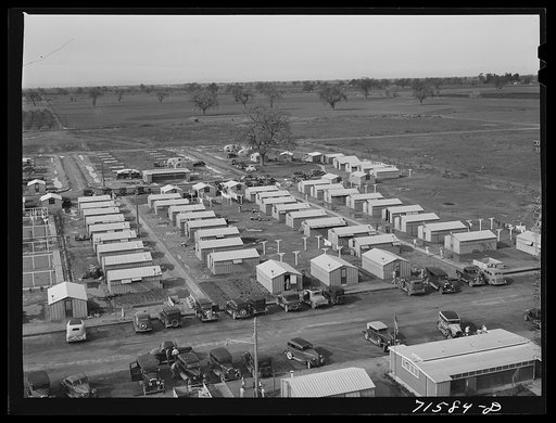 Woodville, California. FSA (Farm Security Administration) farm workers' community. Metal shelters for migrant agricultural workers
