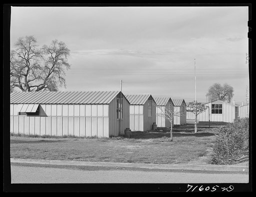 Woodville, California. FSA (Farm Security Administration) farm workers' community. Metal shelters for migrant farm families