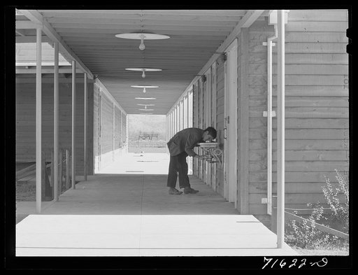 Woodville, California. FSA (Farm Security Administration) farm workers' community. Outside passageways are used wherever possible in the community building