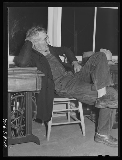 Woodville, California. FSA (Farm Security Administration) farm workers' community. Camper attends the camp council meeting