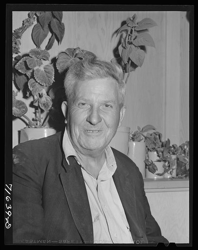 Woodville, California. FSA (Farm Security Administration) farm workers' community. Camper attends the camp council meeting