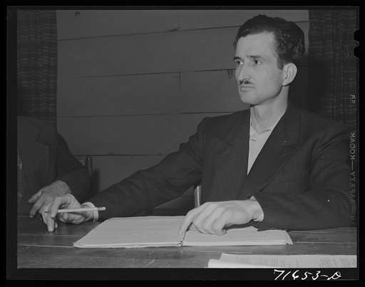 Tulare County, California. FSA (Farm Security Administration) farm workers' camp. Secretary-treasurer of the cooperative store