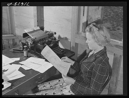Tulare County, California. FSA (Farm Security Administration) farm workers' camp. Getting out the camp paper