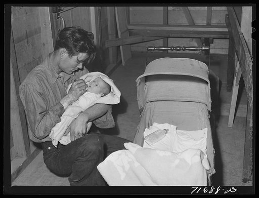 Tulare County, California. FSA (Farm Security Administration) farm workers' camp. A friend minding the baby while the parents dance. President's birthday ball