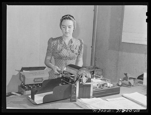 Tulare County, California. FSA (Farm Security Administration) farm workers' camp. Mimeographing the camp paper