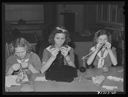Tulare County, California. FSA (Farm Security Administration) farm workers' camp. Girl scouts learning to knit