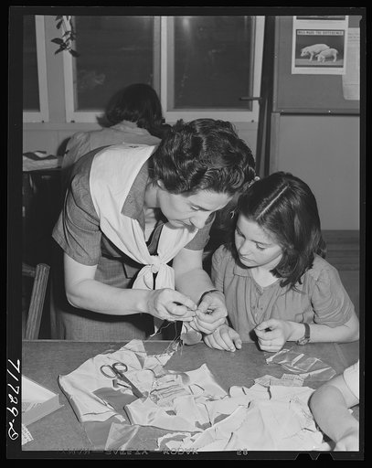 Tulare County, California. FSA (Farm Security Administration) farm workers' camp. Girl Scouts learning to sew