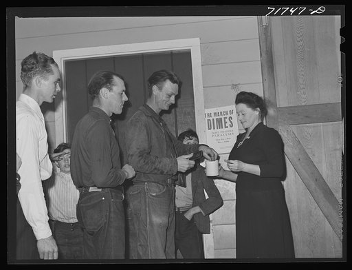 Tulare County, California. FSA (Farm Security Administration) farm workers' camp. Agricultural workers contributing their dimes at the President's birthday ball