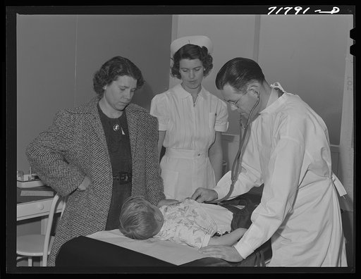 Woodville, California. FSA (Farm Security Administration) farm workers' community. Doctor examining child of agricultural workers at the clinic