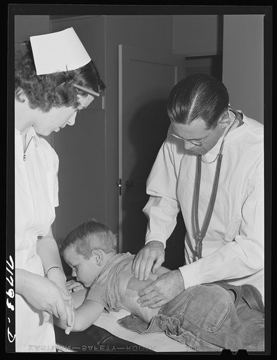 Woodville, California. FSA (Farm Security Administration) farm workers' community. Doctor examining child of agricultural workers at the clinic