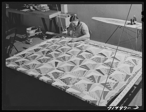 Woodville, California. FSA (Farm Security Administration) farm workers' community. Agricultural worker quilting in the sewing room