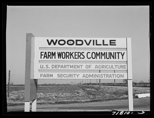 Woodville, California. FSA (Farm Security Administration) farm workers' community. Sign of the community