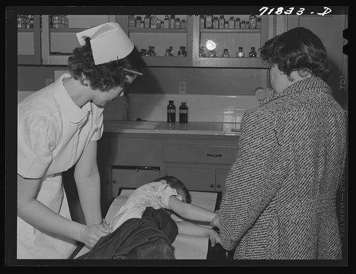 Untitled photo, possibly related to: Woodville, California. FSA (Farm Security Administration) farm workers' community. Doctor examining child of agricultural workers at the clinic
