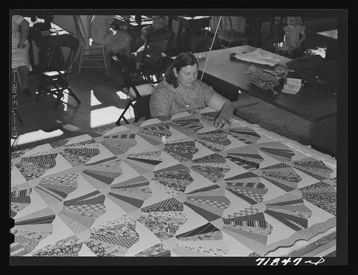 Untitled photo, possibly related to: Woodville, California. FSA (Farm Security Administration) farm workers' community. Agricultural worker quilting in the sewing room