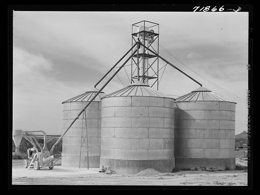 Triple grainery at Casa Grande Farms, FSA (Farm Security Administration) project at Coolidge, Pinal County, Arizona