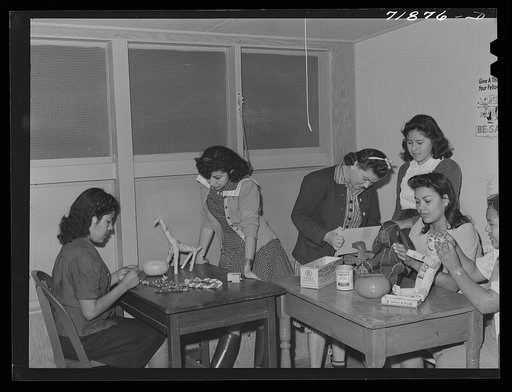 NYA (National Youth Administration) girls who live at the resident center at the FSA (Farm Security Administration) farm workers' community at Eleven Mile Corner, Arizona, learn to use waste materials for toys, jewelry, etc.