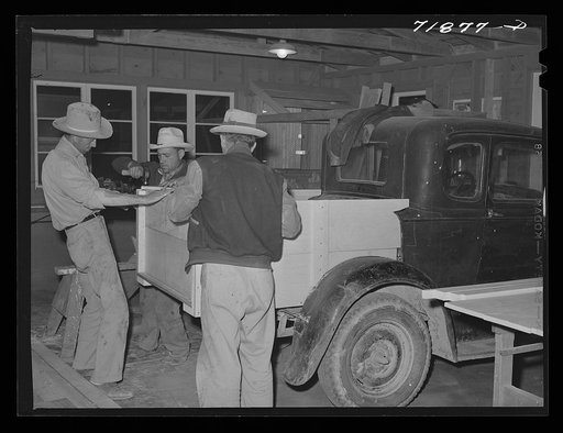 Men build truck back for automobile at the workshop at the FSA (Farm Security Administration) farm workers' community. Eleven Mile Corner, Arizona