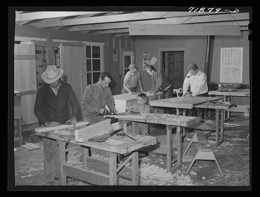 Agricultural workers in the workshop at the FSA (Farm Security Administration) farm workers' community at Eleven Mile Corner, Arizona
