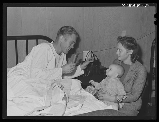 Visitors' hour at the Cairns Hospital at the FSA (Farm Security Administration) farm workers' community. Eleven Mile Corner, Arizona