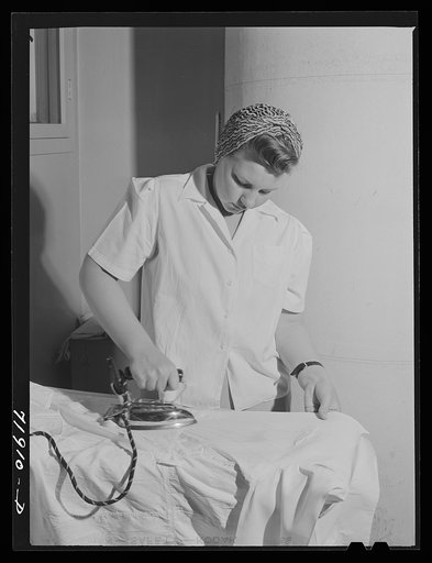 Eleven Mile Corner, Arizona. Cairns General Hospital, FSA (Farm Security Administration) farm workers' community. NYA (National Youth Administration) girl who lives in the resident center working in the laundry