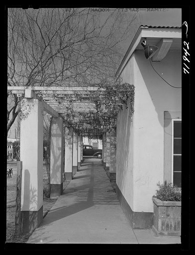 Phoenix, Arizona. Camelback Farms, FSA (Farm Security Administration) project. Open passageway of the community building