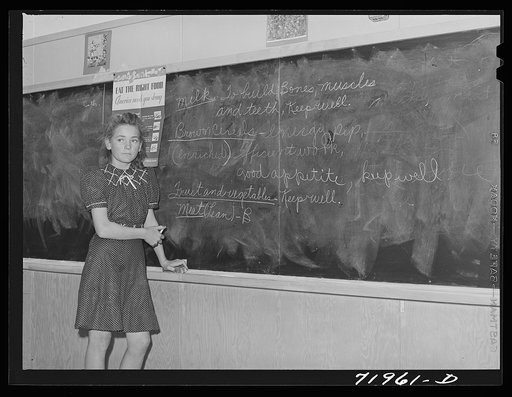 Children learn of the need for well-balanced diet at the school at the FSA (Farm Security Administration) farm workers' community. Eleven Mile Corner, Arizona