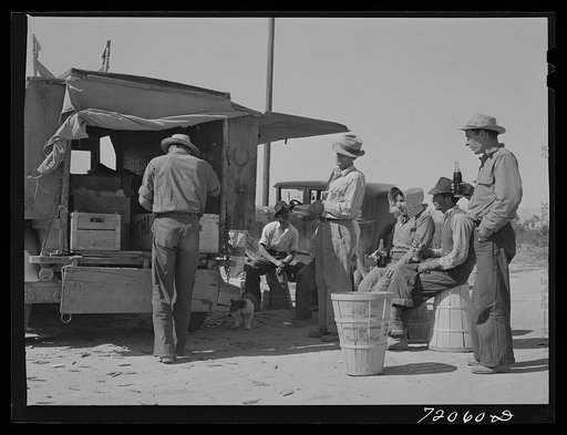 Pea pickers stop for a soft drink. Imperial County, California