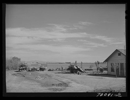 Farmyard, Imperial County, California. In Imperial County, comparatively few farm owners live on the farms, usually the houses seen on the farms are those of the foremen