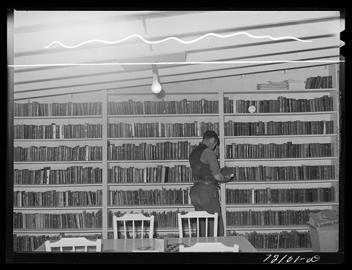 Untitled photo, possibly related to: In the library of the FSA (Farm Security Administration) farm families community. Yuma, Arizona