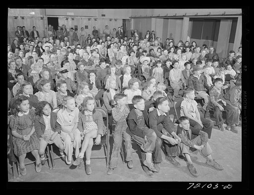Untitled photo, possibly related to: At the picture show at the FSA (Farm Security Administration) farm workers' community mobile unit. Friendly Corners, Arizona