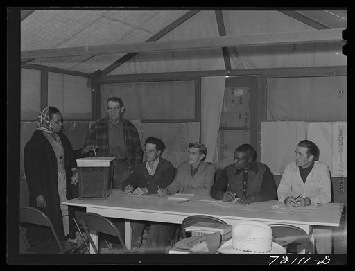 Farm workers who live at the FSA (Farm Security Administration) farm workers' community mobile unit vote for camp council members. Friendly Corners, Arizona