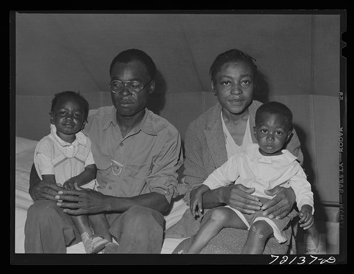 Family of farm workers who live at the FSA (Farm Security Administration) farm workers' community mobile unit. Friendly Corners, Arizona