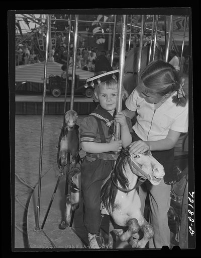 On the merry-go-round. Imperial County Fair, California
