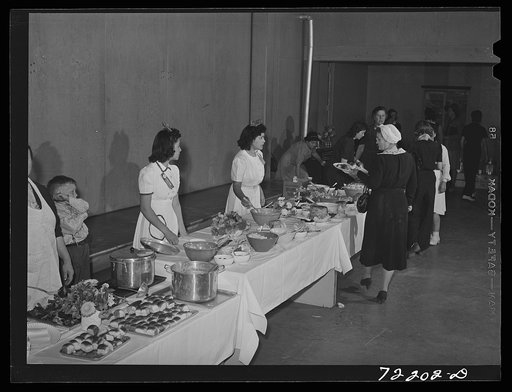 Dinner in the community auditorium at the second annual field day  at the FSA (Farm Security Administration) farm workers' community. Yuma, Arizona